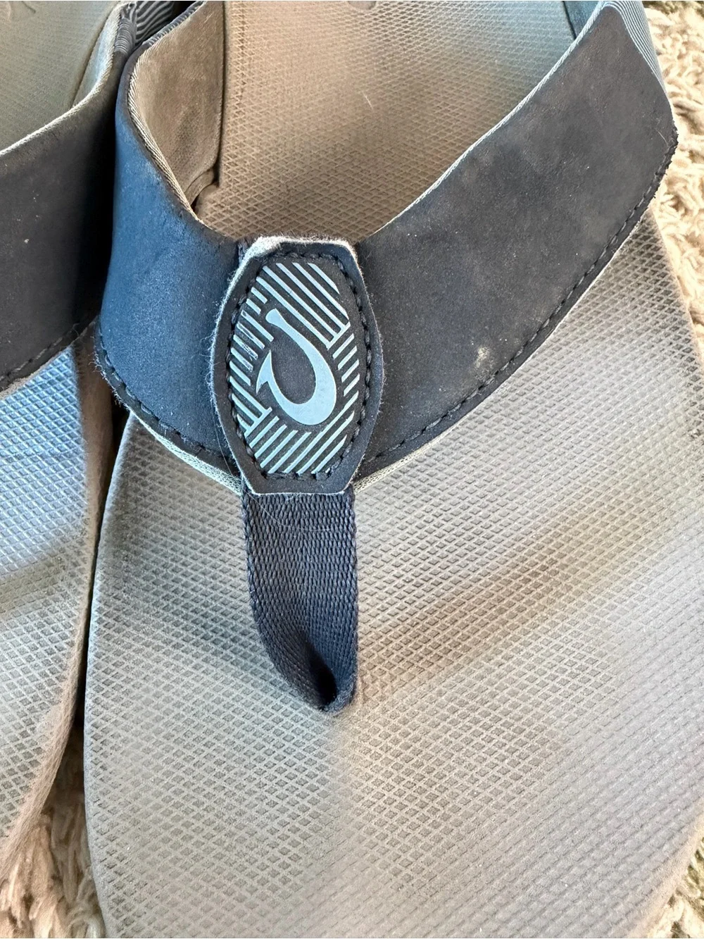 OluKai Gray and Black Thong Sandals